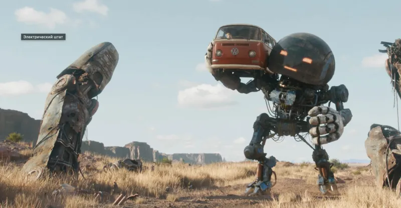 Милли Бобби Браун стоит рядом с большим желтым роботом на фоне пустоши